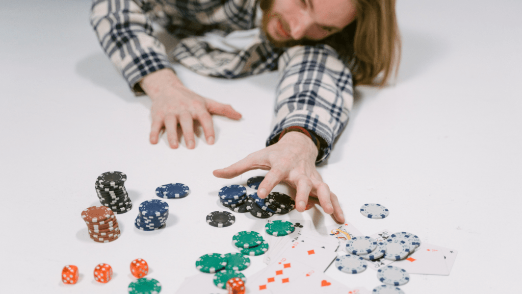 Man reaching casino chips