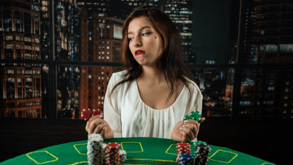 Woman playing poker and winning casino chips